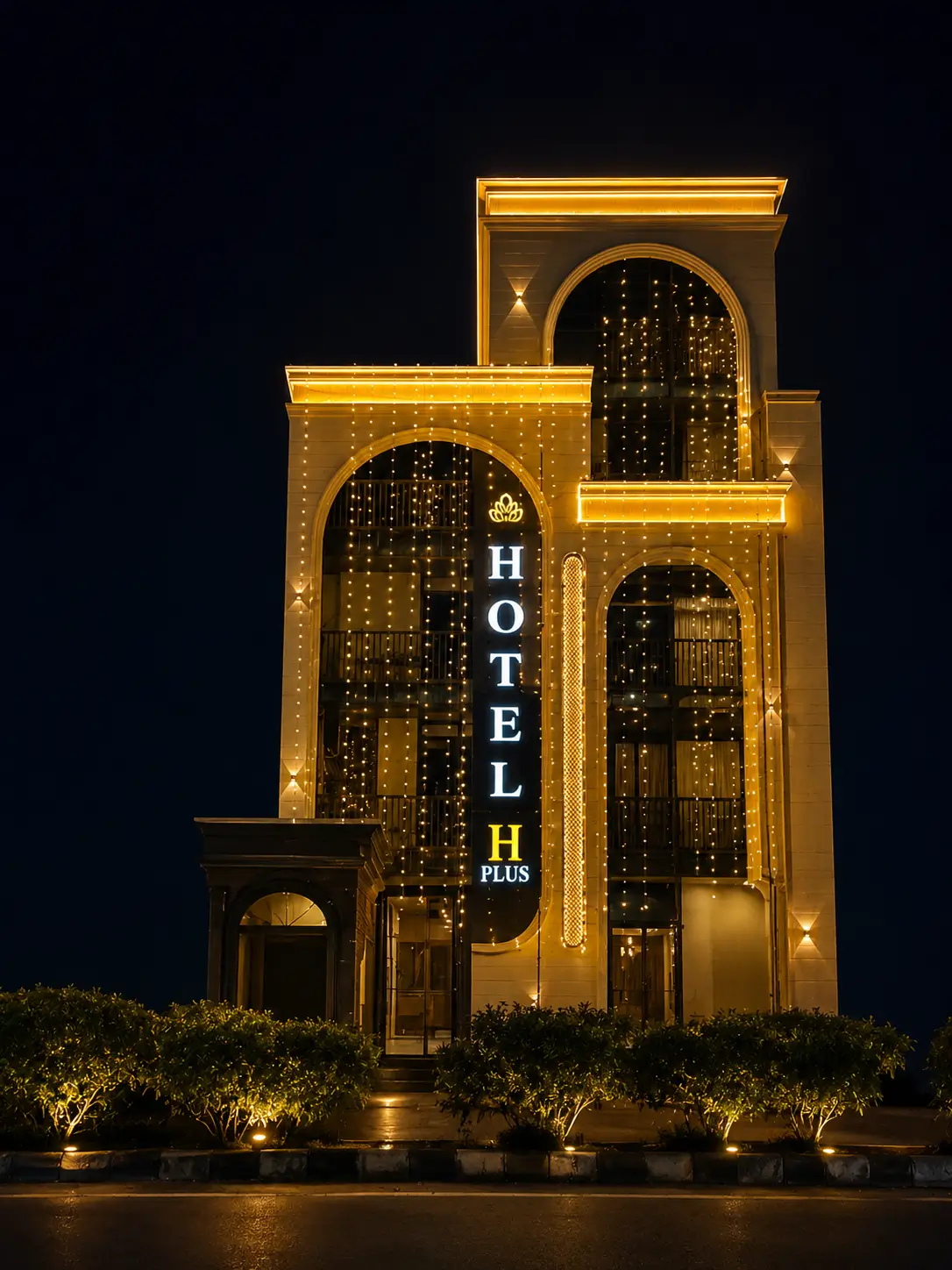 Hotel H Plus exterior illuminated at night