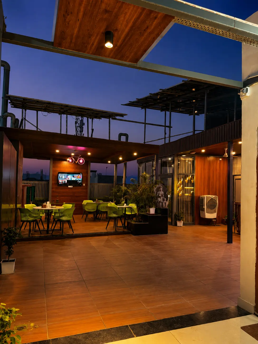 Open rooftop dining area at Hotel H Plus